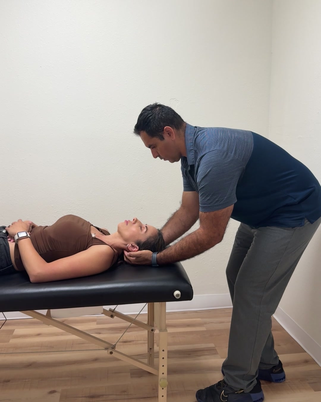 Dr. Andrew Cisneros, PT, DPT, performing cervical manual therapy on a patient at Solas Physical Therapy in El Paso