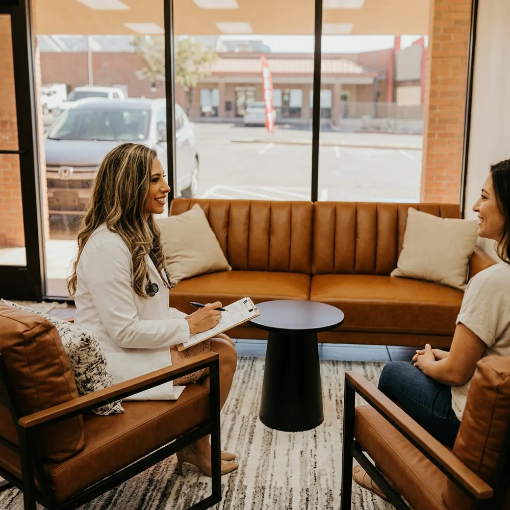 Celeste Cisneros, FNP-BC consulting with a patient at Solas Health in El Paso, TX